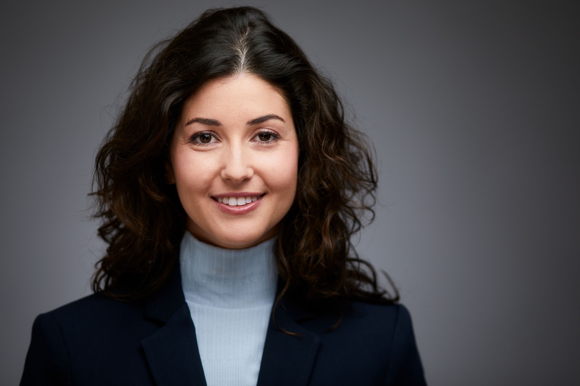 Studio headshot of a businesswoman.